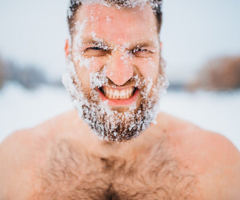 man smiling after being in snow